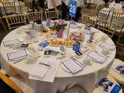 Table set up at the Surrey/Langley/North Delta Chapter Breakfast with the Bank event