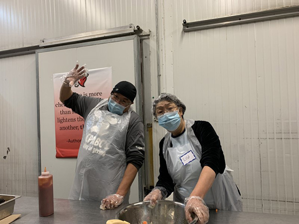 Chapter Volunteers Making food at A Loving Spoonful