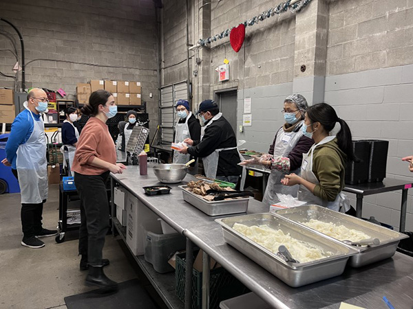  Chapter Volunteers Making food at A Loving Spoonful