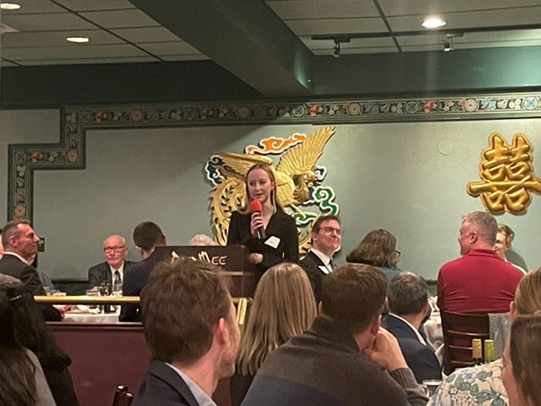 Last year’s award recipient, Laura Bull, speaking at this years Chapter Lunar New Year Dinner and Auction