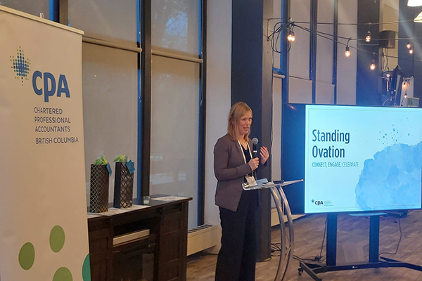 Lori Mathison addressing members at PNW Standing ovation event
