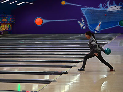 Attendee prepares to bowl