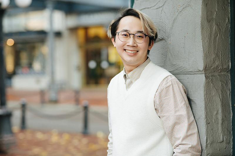 Frederick Wong standing in front of a tree in Gastown