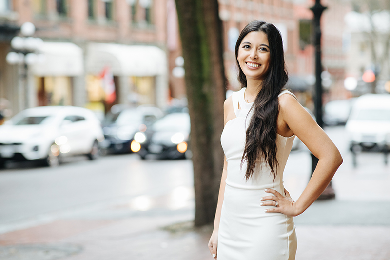 Karina Pangilinan posing in front of a tree in Gastown