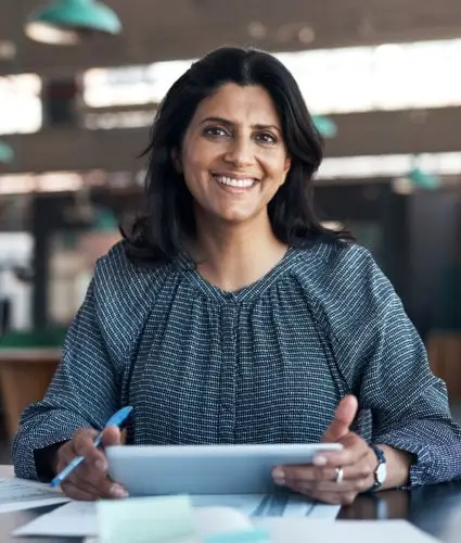 A smiling woman with tablet