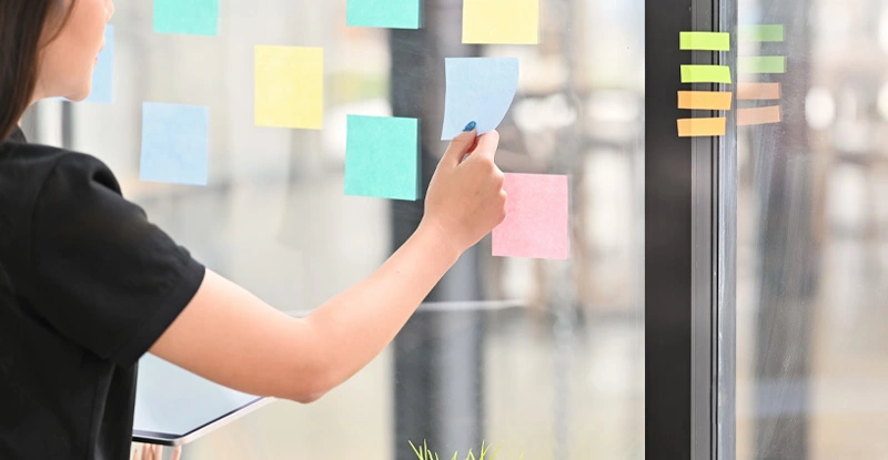 Sticky note paper reminder young woman share idea on sticky note. Discussing - business.